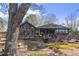 Beautiful single Gathering home featuring large glass windows, a spacious porch, a well-manicured lawn and easy access to the lake at 3093 Brookshire Way, Duluth, GA 30096