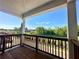 Relaxing covered balcony boasts scenic views of nature and a mountain in the distance at 542 Sawnee Village Blvd # D69, Cumming, GA 30040