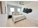 Bedroom featuring a ceiling fan and black circular decorations above the bed at 542 Sawnee Village Blvd # D69, Cumming, GA 30040