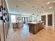 Stylish kitchen island with bar seating and open layout to the dining and living area at 542 Sawnee Village Blvd # D69, Cumming, GA 30040