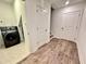 Bright laundry room with a modern washer and dryer, storage, and tiled floors at 542 Sawnee Village Blvd # D69, Cumming, GA 30040