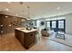 Well-lit living space with modern furnishings open to kitchen, dining area, and back door at 542 Sawnee Village Blvd # D69, Cumming, GA 30040