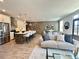 Open-concept living space with a modern kitchen, stylish furnishings, and hardwood floors at 542 Sawnee Village Blvd # D69, Cumming, GA 30040