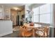 Open kitchen area with wood table, chairs and natural light at 660 Delbridge Nw St, Atlanta, GA 30314