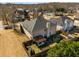 Aerial view of a property featuring a backyard, patio area, and surrounding neighborhood amenities at 4215 Idlewood Dr, Cumming, GA 30040