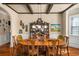 Elegant dining room with hardwood floors, coffered ceilings, and a classic china cabinet next to a window at 4215 Idlewood Dr, Cumming, GA 30040