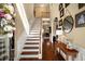 Elegant foyer with hardwood floors, a staircase, and decorative accents creating a welcoming entrance at 4215 Idlewood Dr, Cumming, GA 30040