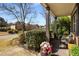 Cozy front porch with seating, lush greenery, and tasteful landscaping, perfect for relaxing outdoors at 4215 Idlewood Dr, Cumming, GA 30040