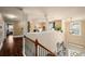 Second story hallway with hardwood floors overlooking the main floor at 4215 Idlewood Dr, Cumming, GA 30040