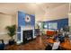 Living room with fireplace, hardwood floors, and modern lighting at 4215 Idlewood Dr, Cumming, GA 30040