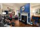 Cozy living room with fireplace, built-in shelving, and hardwood floors at 4215 Idlewood Dr, Cumming, GA 30040