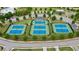 Aerial view of community tennis courts and lush green landscaping at 47 Colonial Ter, Villa Rica, GA 30180