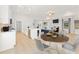 Bright and open living room and kitchen combo featuring hardwood floors, modern furniture and stainless steel appliances at 47 Colonial Ter, Villa Rica, GA 30180