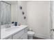 Bathroom featuring a single sink vanity, quartz countertop and modern finishes at 7652 Baron Rd, Fairburn, GA 30213