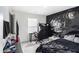 Teen bedroom with black gaming theme and gaming desk at 7652 Baron Rd, Fairburn, GA 30213