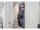 Walk-in closet with hanging clothes and ample storage space at 7652 Baron Rd, Fairburn, GA 30213