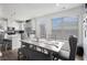 Bright dining area with an adjacent kitchen at 7652 Baron Rd, Fairburn, GA 30213