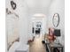 Bright hallway featuring hardwood floors, leading to an open-concept layout at 7652 Baron Rd, Fairburn, GA 30213