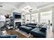 Cozy living room with fireplace, built-in shelving, and comfortable seating at 7652 Baron Rd, Fairburn, GA 30213