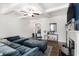 Bright and airy living room with coffered ceilings and a modern fireplace at 7652 Baron Rd, Fairburn, GA 30213