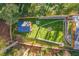 Aerial view of the landscaped backyard with a gazebo, fire pits and stone pathway at 842 Laurelmont Sw Dr, Atlanta, GA 30311