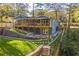 Inviting backyard featuring a stone terrace, covered deck and manicured lawn at 842 Laurelmont Sw Dr, Atlanta, GA 30311