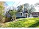 Charming single-story home featuring a well-manicured lawn and a blend of modern and traditional architectural elements at 842 Laurelmont Sw Dr, Atlanta, GA 30311