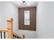 Hallway featuring a staircase and a decorative wood accent wall with a window at 842 Laurelmont Sw Dr, Atlanta, GA 30311