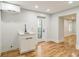 Well lit Living room with beautiful hardwood floors, a door to the outside and a sink for convenience at 842 Laurelmont Sw Dr, Atlanta, GA 30311