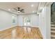 Bright living room with hardwood floors, recessed lighting, ceiling fan and french doors to the backyard at 842 Laurelmont Sw Dr, Atlanta, GA 30311