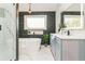 Bright main bathroom featuring soaking tub, glass shower, and modern vanity at 842 Laurelmont Sw Dr, Atlanta, GA 30311