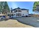 Expansive backyard featuring a large patio, built-in fire pit and a lush lawn at 10683 Glenleigh Dr, Johns Creek, GA 30097