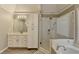 Bathroom with a large cabinet, a single sink, and a shower that has glass door at 10683 Glenleigh Dr, Johns Creek, GA 30097