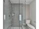 Bathroom featuring glass shower, gray subway tiles, and marble tile flooring at 10683 Glenleigh Dr, Johns Creek, GA 30097