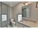 Bathroom featuring glass shower and single sink vanity at 10683 Glenleigh Dr, Johns Creek, GA 30097