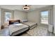 A bedroom with two twin beds, hardwood flooring and ceiling fan at 10683 Glenleigh Dr, Johns Creek, GA 30097