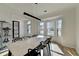 Spacious dining room featuring wood floors and a large marble table at 10683 Glenleigh Dr, Johns Creek, GA 30097