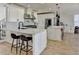 Modern kitchen with white cabinets, marble countertops, stainless steel appliances, and center island at 10683 Glenleigh Dr, Johns Creek, GA 30097