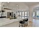 Bright kitchen features white cabinets, stainless steel appliances, and a large center island at 10683 Glenleigh Dr, Johns Creek, GA 30097