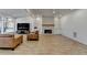 Spacious living room features a fireplace, modern lighting, and hardwood floors at 10683 Glenleigh Dr, Johns Creek, GA 30097