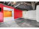 Unfinished basement with exposed ductwork, concrete walls, and colorfully painted adjacent rooms at 160 Deer Cliff Cv, Lawrenceville, GA 30043