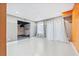 Finished basement area with recessed lighting, painted floor, and a sectioned-off utility area at 160 Deer Cliff Cv, Lawrenceville, GA 30043