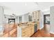Kitchen and living area with hardwood floors and granite countertops with stainless steel appliances at 160 Deer Cliff Cv, Lawrenceville, GA 30043