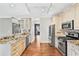 Eat-in kitchen features granite countertops, stainless steel appliances, and hardwood floors at 160 Deer Cliff Cv, Lawrenceville, GA 30043