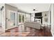 Bright living room featuring hardwood floors, a fireplace, and a door to the backyard at 160 Deer Cliff Cv, Lawrenceville, GA 30043