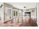 Living room features a fireplace, ceiling fan, hardwood floors, and access to the backyard at 160 Deer Cliff Cv, Lawrenceville, GA 30043