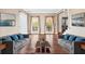Open living room with hardwood floors, natural light, and neutral paint at 160 Deer Cliff Cv, Lawrenceville, GA 30043