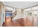 Open-concept living space with hardwood floors and views into other rooms of the home at 160 Deer Cliff Cv, Lawrenceville, GA 30043