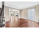 Spacious living room boasts hardwood floors and access to a living area with fireplace at 160 Deer Cliff Cv, Lawrenceville, GA 30043
