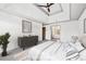 Main bedroom with trey ceilings, dresser, and en suite bathroom at 160 Deer Cliff Cv, Lawrenceville, GA 30043
